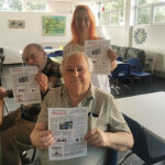 Queensway residents wth newsletter image